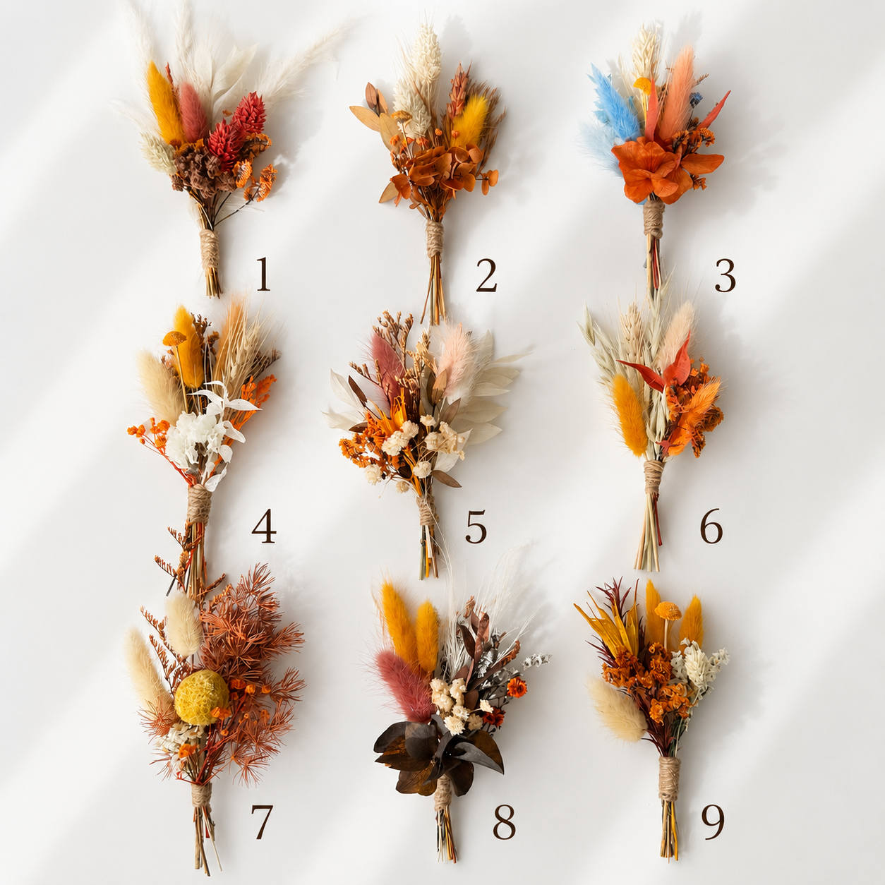 dried floral and feather botanical arrangements arranged 