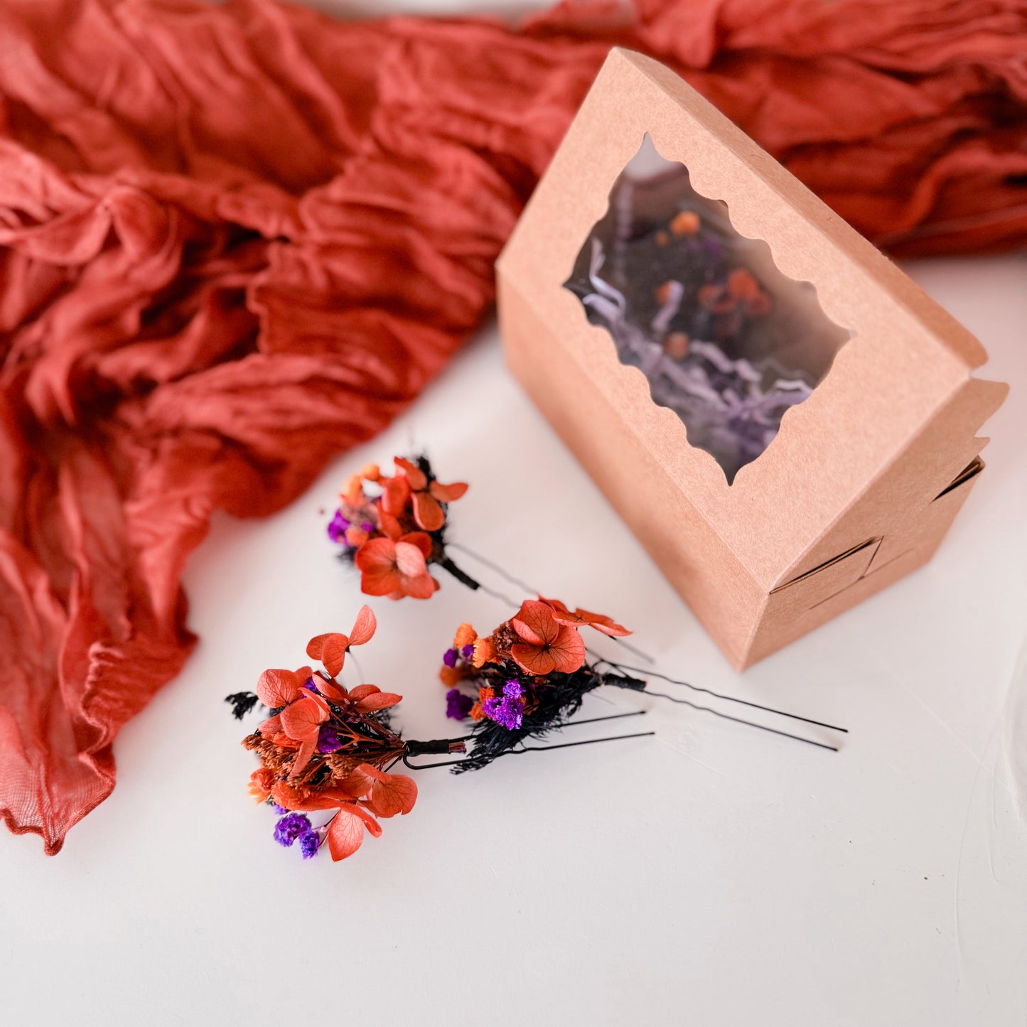 Close-up of dried floral hair pins packed in a kraft gift box — sustainable Australian handmade wedding accessory.
