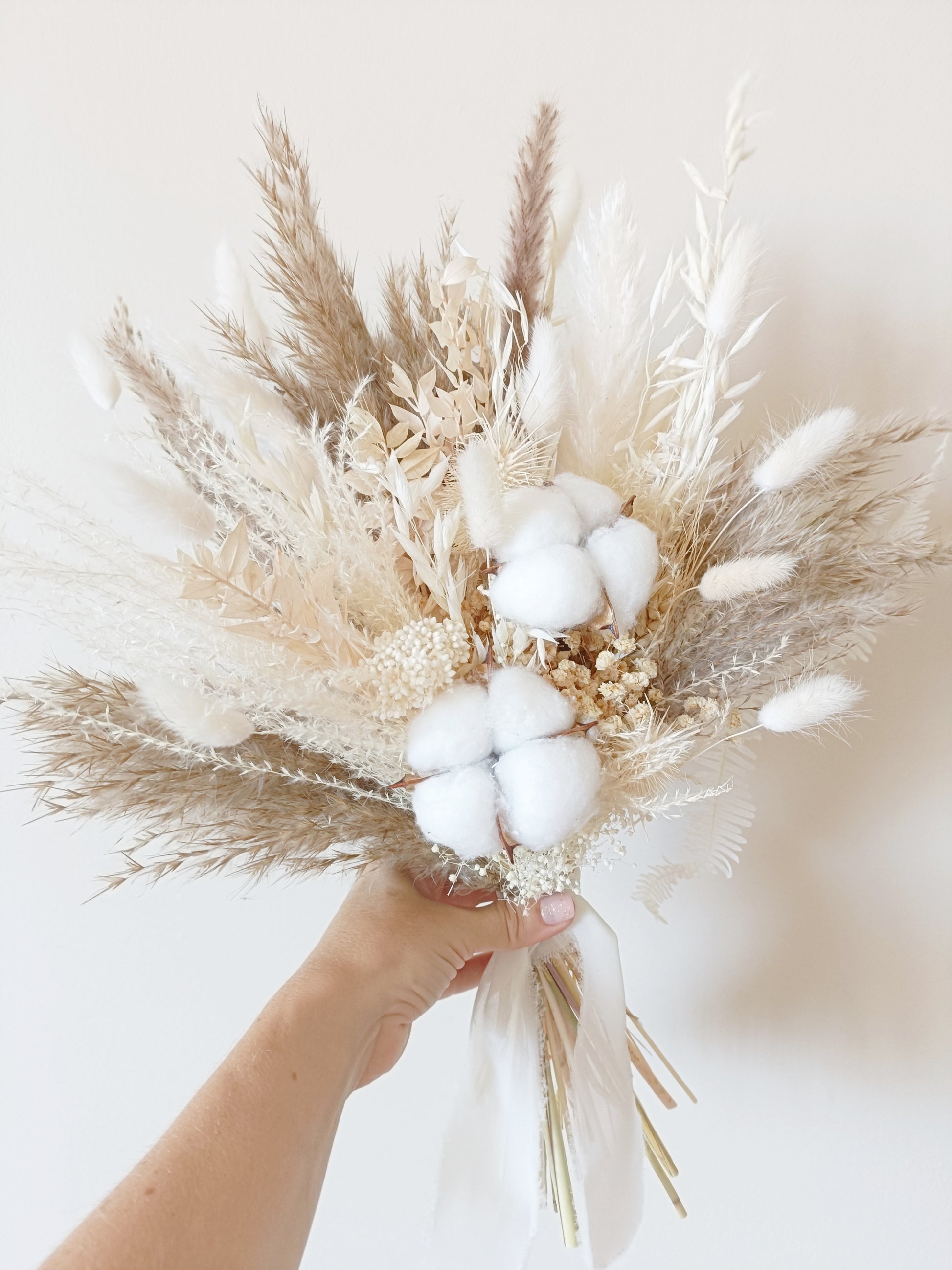 dried flower bridal bouquet, boho wedding bouquet, neutral dried bouquet, rustic dried flower bouquet, pampas grass wedding bouquet, cotton bridal bouquet, preserved flower bouquet, beige and white wedding bouquet, minimalist dried bouquet, boho chic bridal flowers, natural wedding bouquet, ivory dried flower bouquet, handmade dried wedding bouquet, rustic boho bouquet, timeless dried flower arrangement, dried floral wedding bouquet, sola wood flower bouquet, dried wedding flowers, bridal bouquet cotton