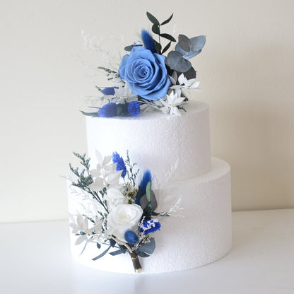 Two-piece dried flower cake topper with blue rose and preserved foliage for modern wedding cakes