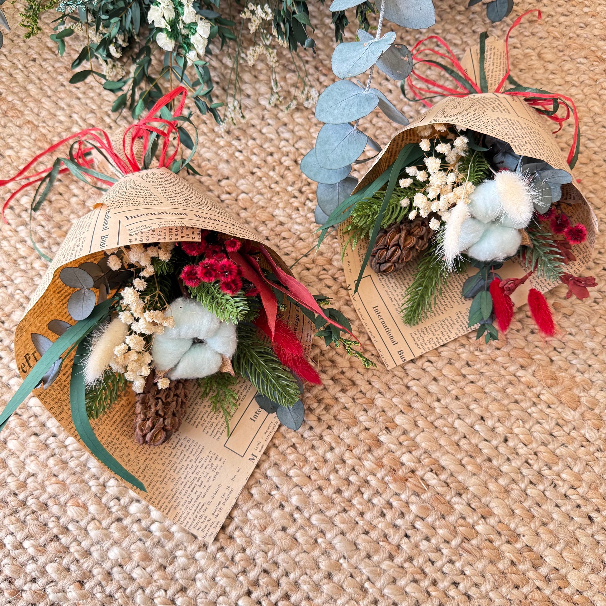 Dried flower mini bouquet in newspaper wrap — rustic Christmas arrangement with baby’s breath and preserved foliage