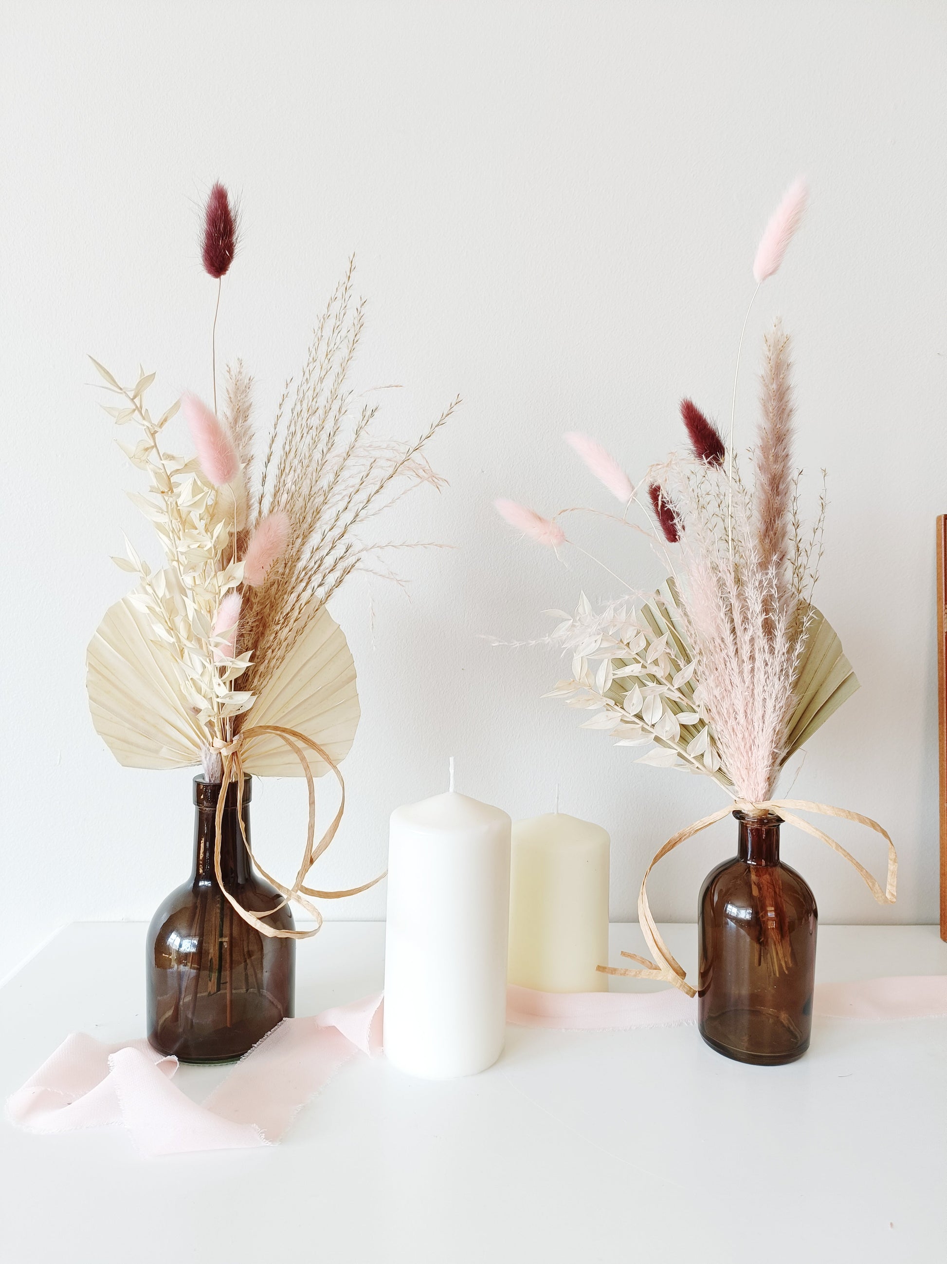 wedding table decor, event table styling, elegant centerpiece, floral arrangement, table setting, rustic wedding, boho table decor, vintage table setup, romantic tablescape, minimalist wedding decor, luxury event design, dried flower centerpiece, soft color palette, aesthetic table arrangement, candlelit dinner, natural wedding decor, modern table styling, cozy reception setup, timeless elegance, pastel wedding theme, chic tablescape, organic table decor, sophisticated floral design, intimate wedding setup