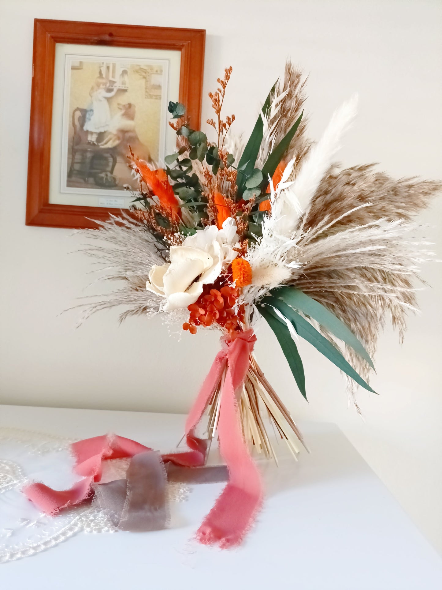 Full view of handmade dried bouquet featuring orange highlights, sola flowers and soft, flowing pampas grass – long-lasting and eco-friendly.
