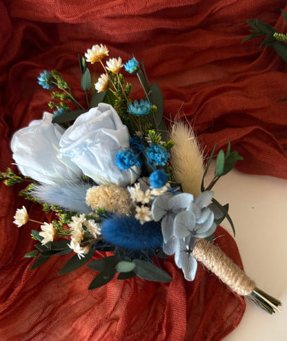Dusty blue wedding boutonniere handmade with sola wood flowers, preserved eucalyptus, and dried florals — rustic boho accessory for grooms and groomsmen.