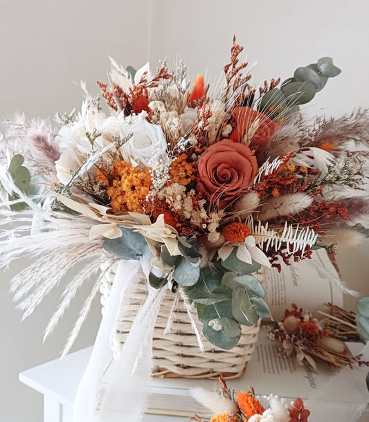 Full front view of a handcrafted dried flower bouquet in burnt orange, ivory, and terracotta tones with preserved botanicals and natural textures.