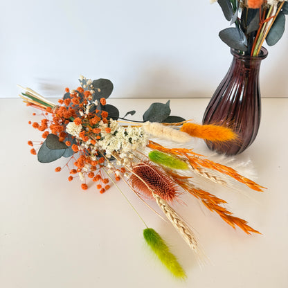 Handmade dried flower arrangement with terracotta bunny tails, ivory accents, and eucalyptus, ideal for boho home or event decor