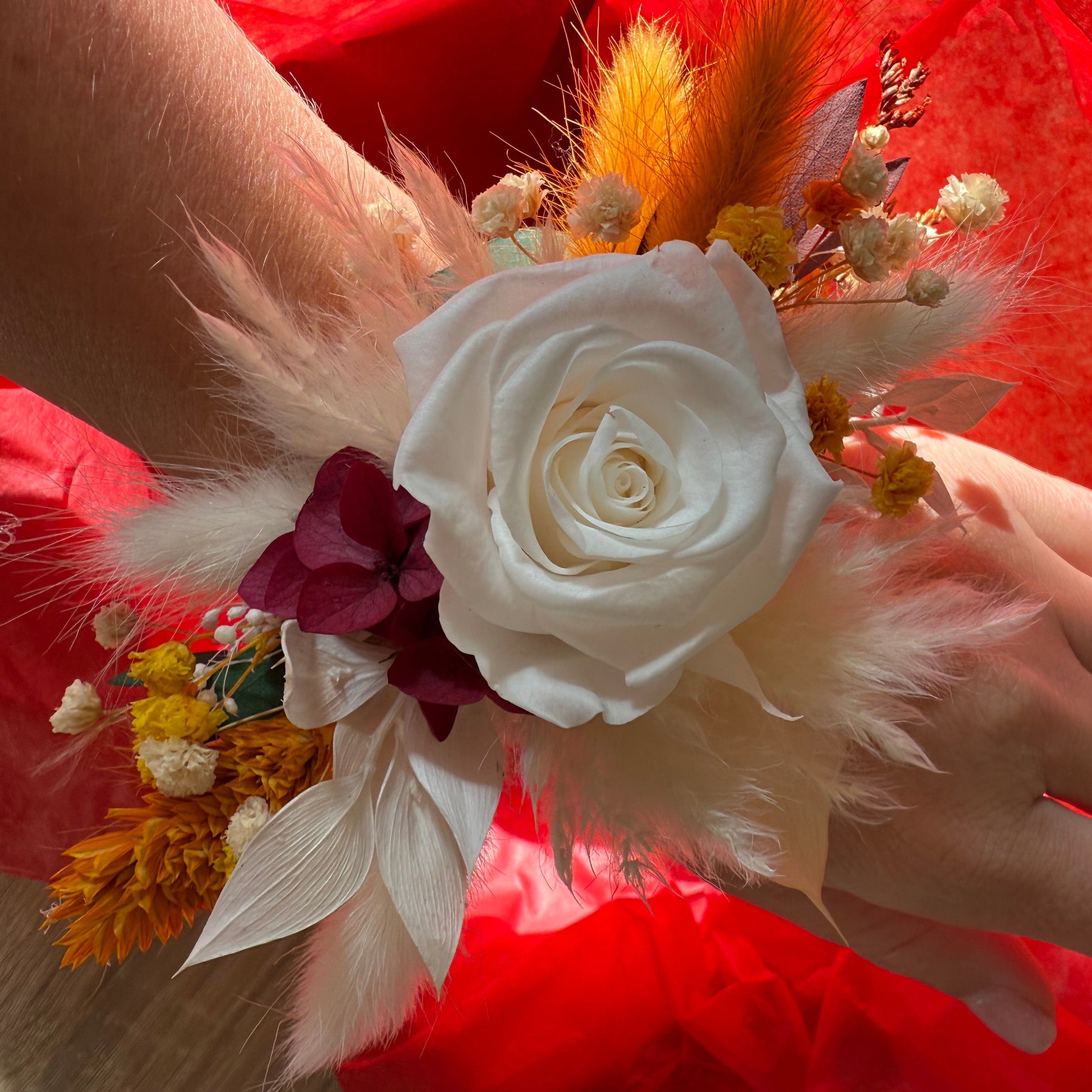 Romantic dried wrist corsage with preserved white rose and burgundy accents