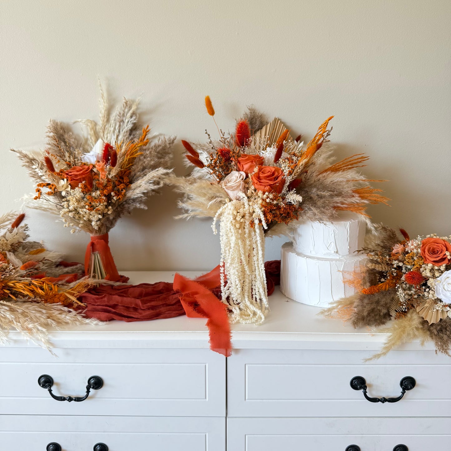 Matching terracotta bouquet and boutonniere wedding set
