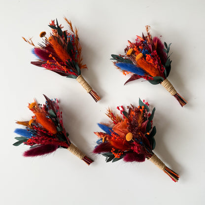 Matching dried flower boutonnieres for groom and groomsmen.