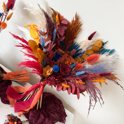 Colorful dried flower arrangement on a white background