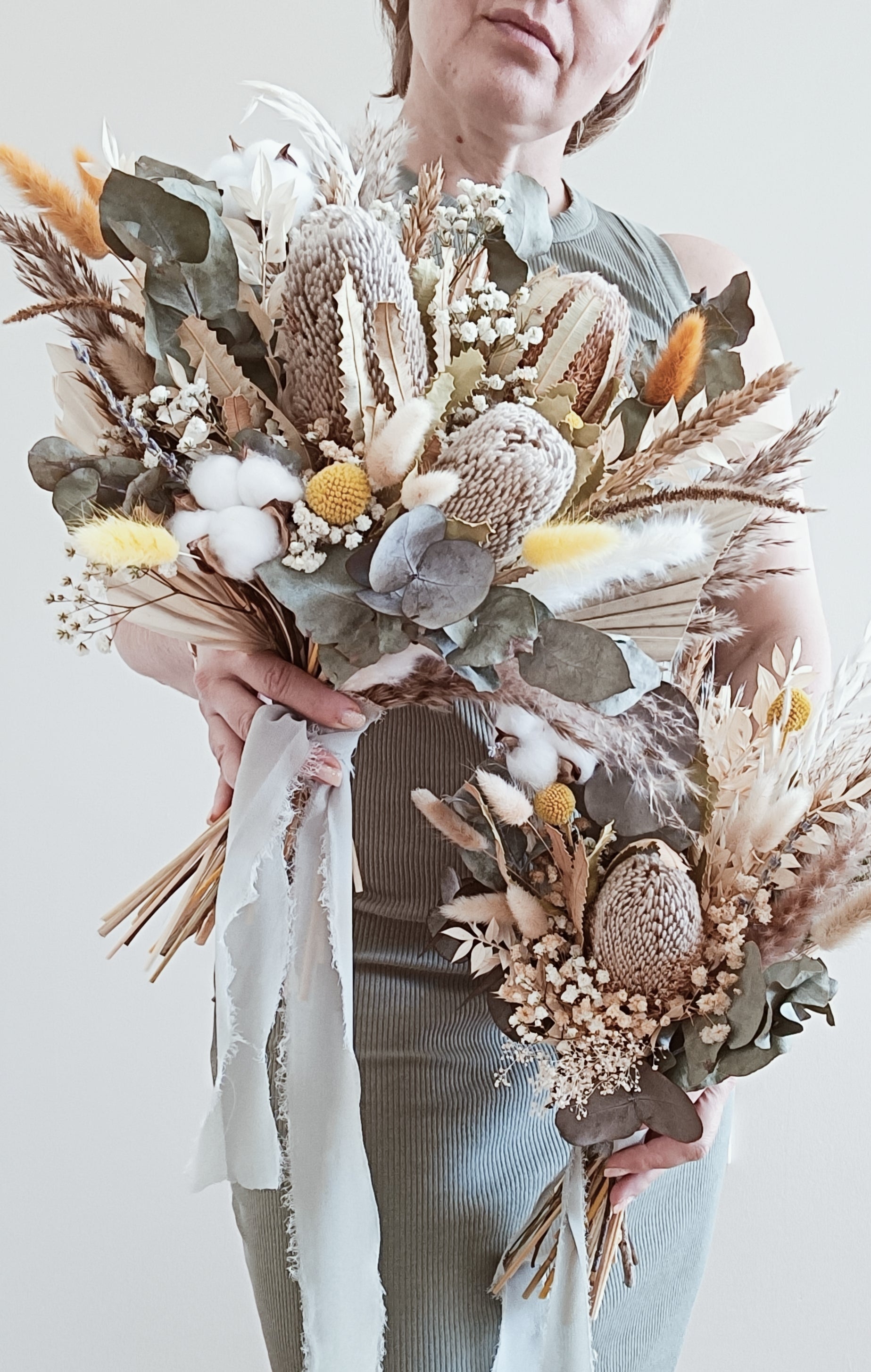 Australian native dried flower bridal bouquet with preserved banksia, eucalyptus, craspedia, and cotton – perfect for rustic or boho weddings.