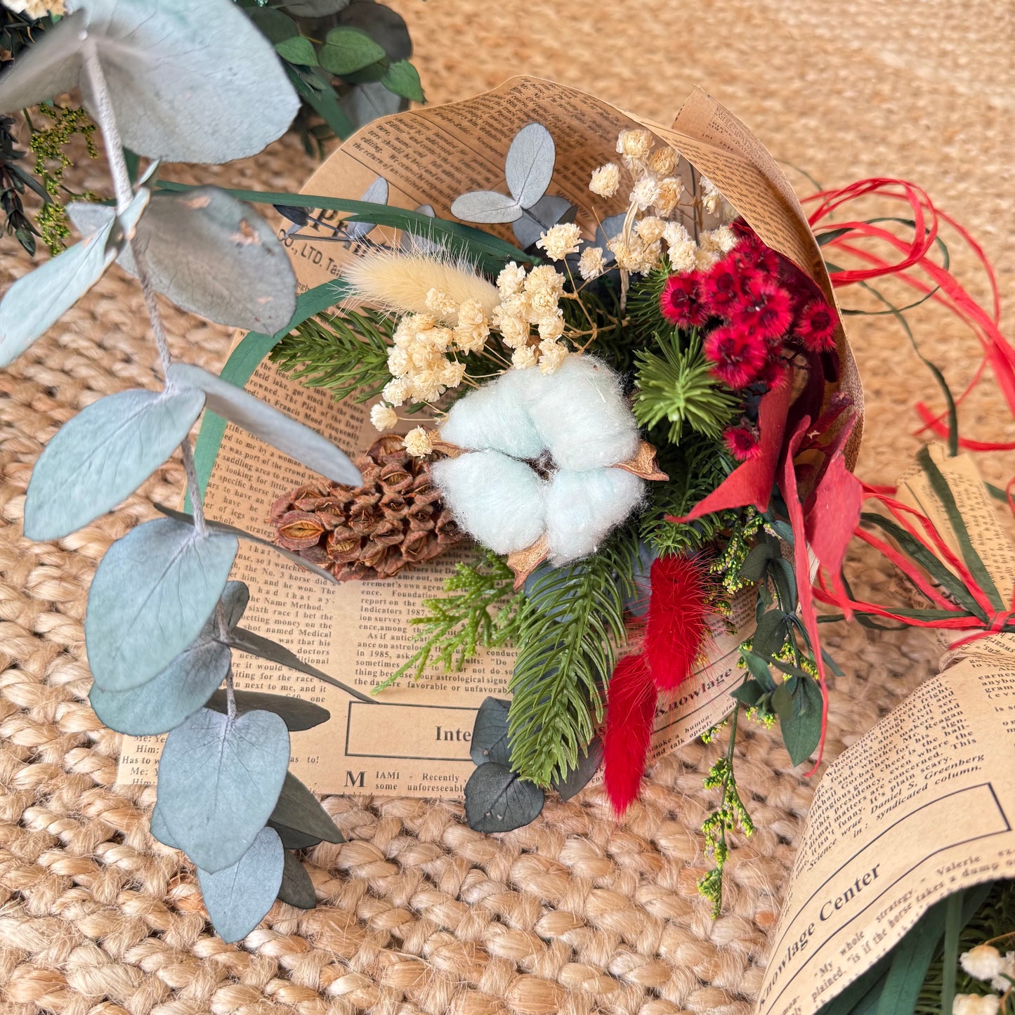 Dried Christmas bouquet with cotton, cone, eucalyptus, and red florals — sustainable handmade holiday decoration