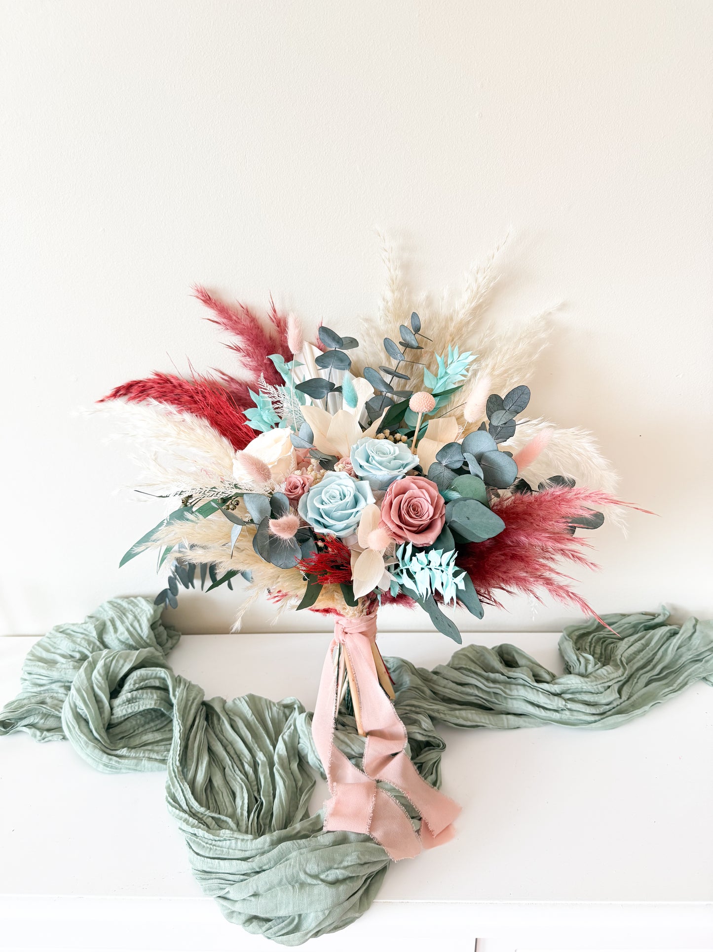 Preserved wedding bouquet closeup with seafoam, tiffany blue, and blush roses — boho rustic design from Sydney Australia
