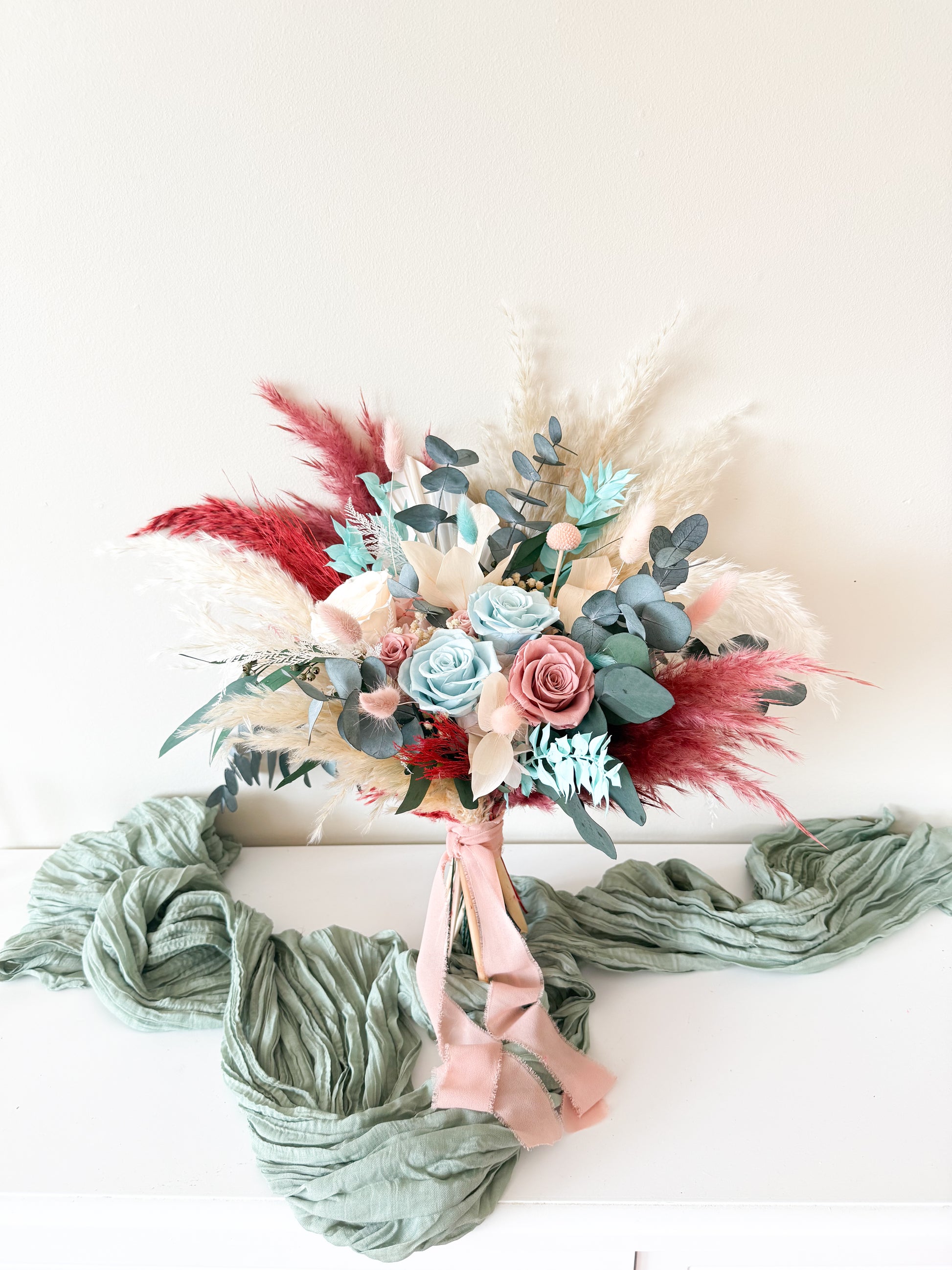 Preserved wedding bouquet closeup with seafoam, tiffany blue, and blush roses — boho rustic design from Sydney Australia