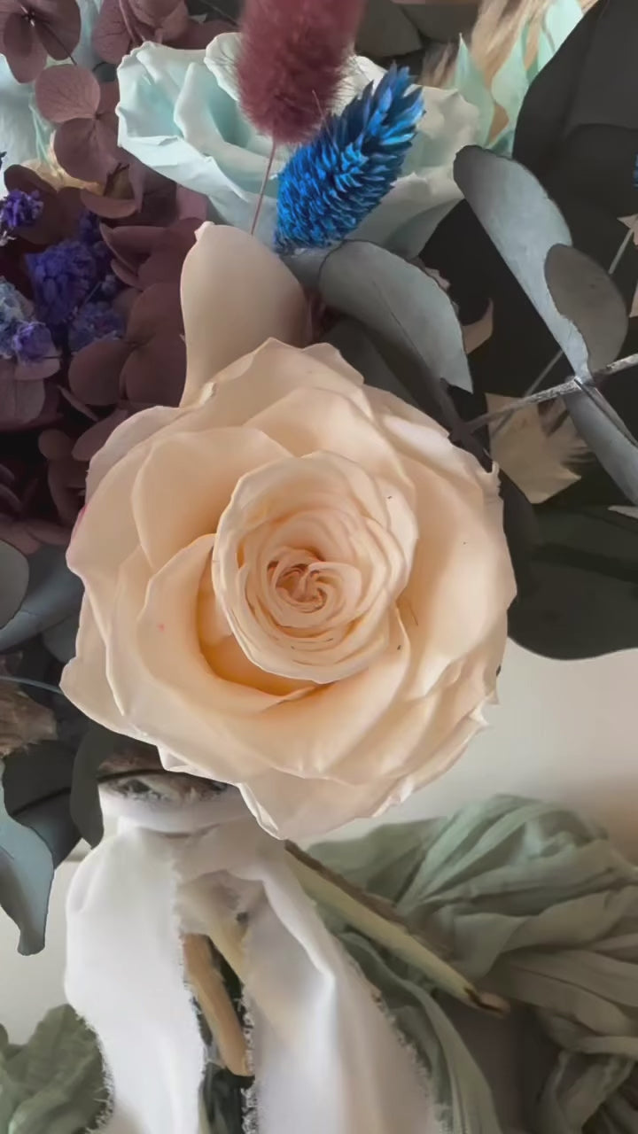  teal and navy dried flower bouquet in boho rustic style