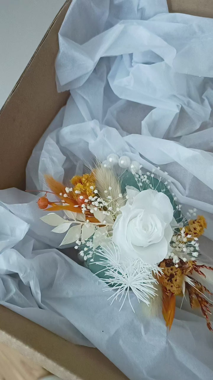 Boho wedding wrist corsage pair in white, mustard, and sage tones with artificial roses and dried florals