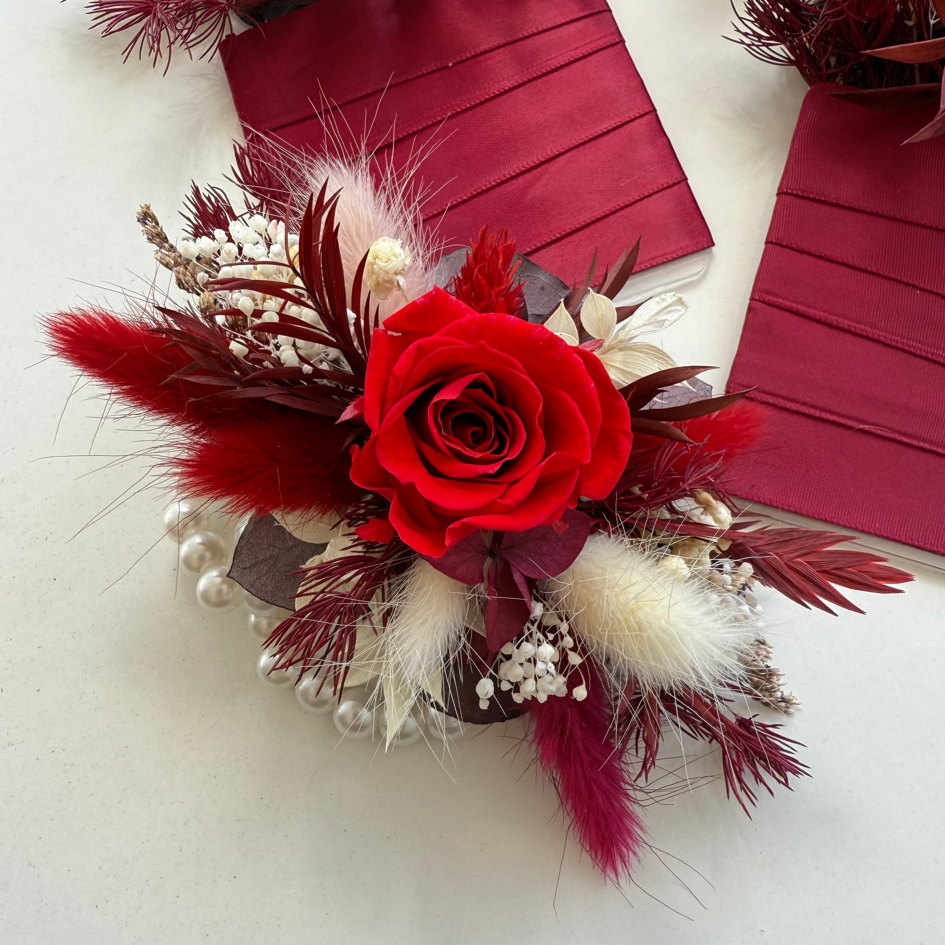 Red and ivory dried flower arrangement with sola roses, ruscus and phalaris, beautifully presented in a square gift box â€” perfect Valentineâ€™s or anniversary gift.
