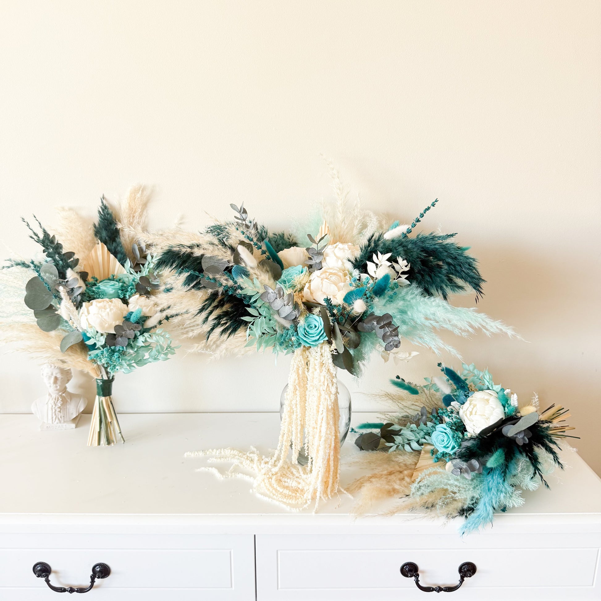 Rustic boho bouquet with teal and cream flowers for wedding decor