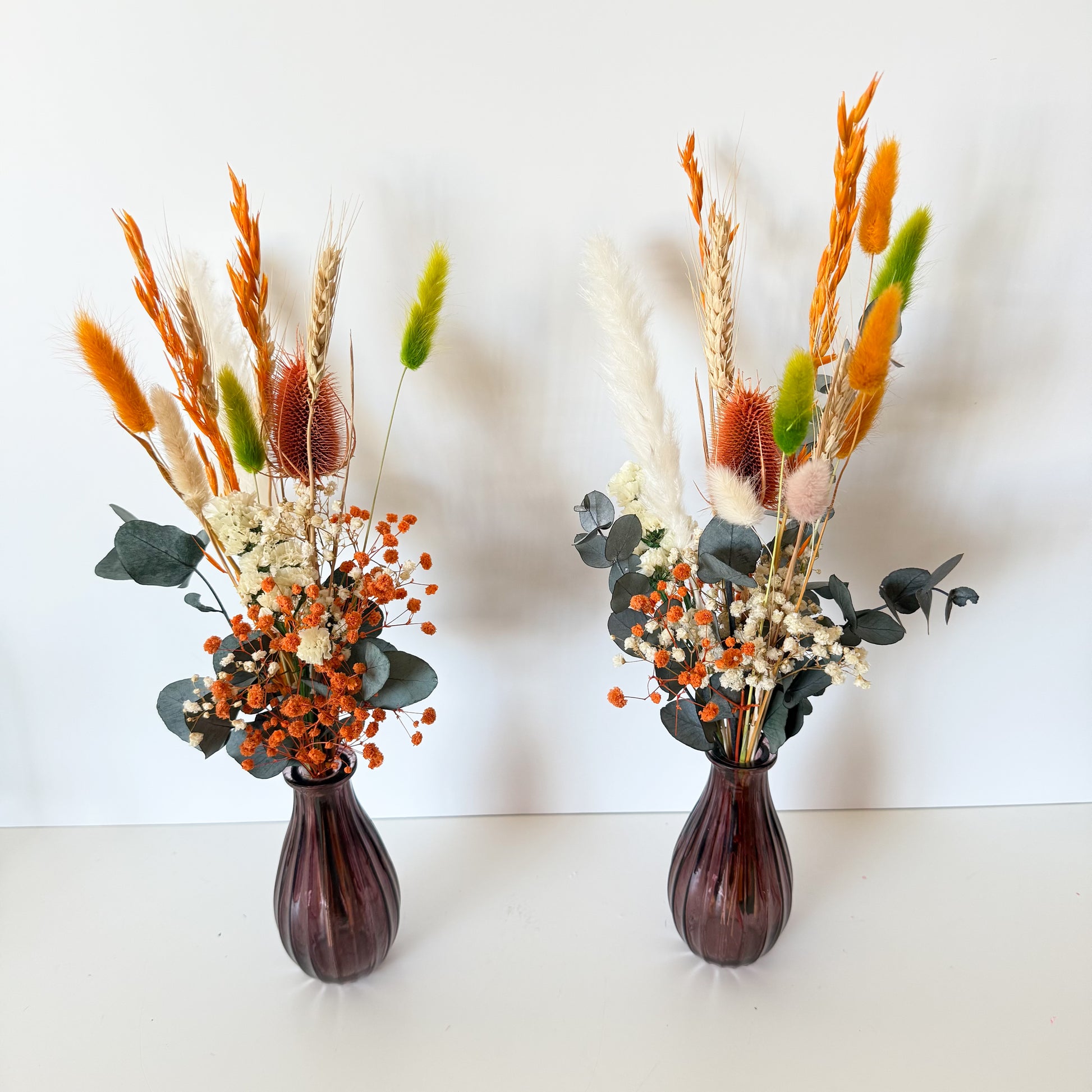 Set of two rustic boho dried flower arrangements with terracotta and orange tones, sold without vase and available with bulk price