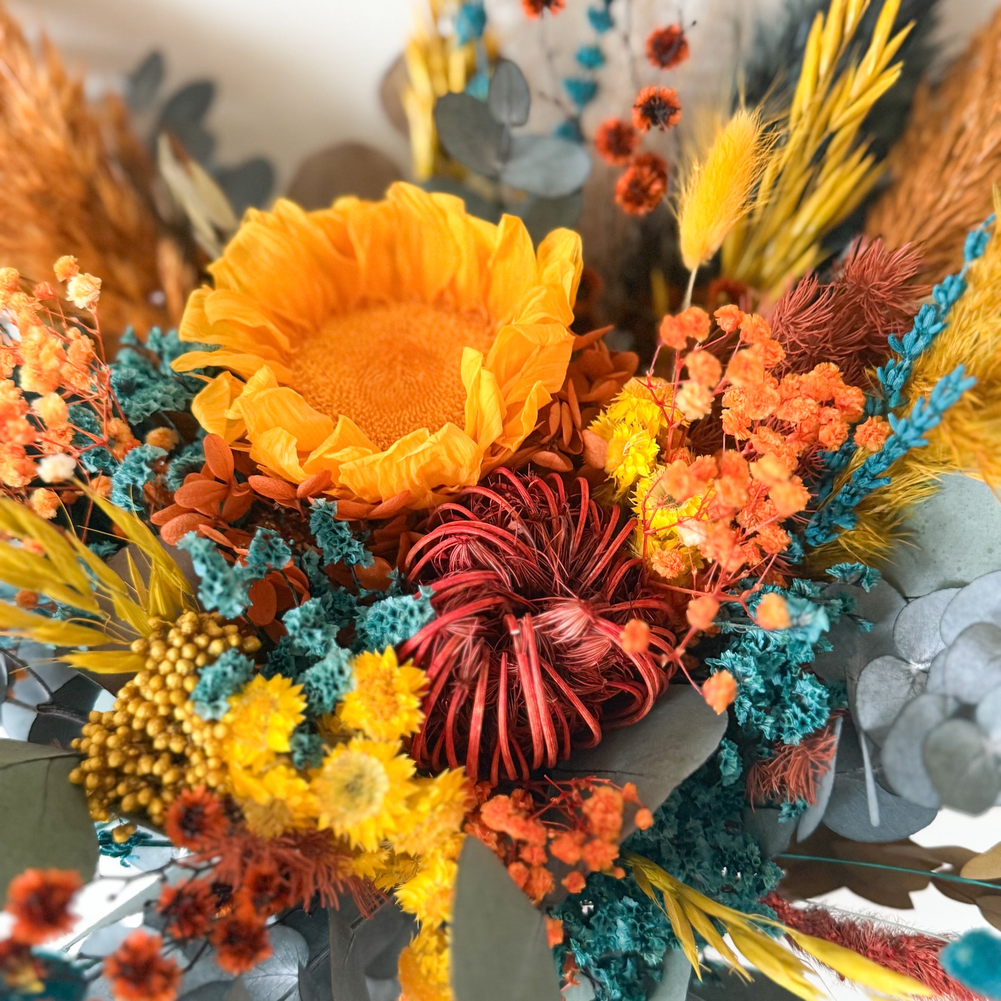 Colorful bouquet of dried flowers with sunflowers and other varieties.