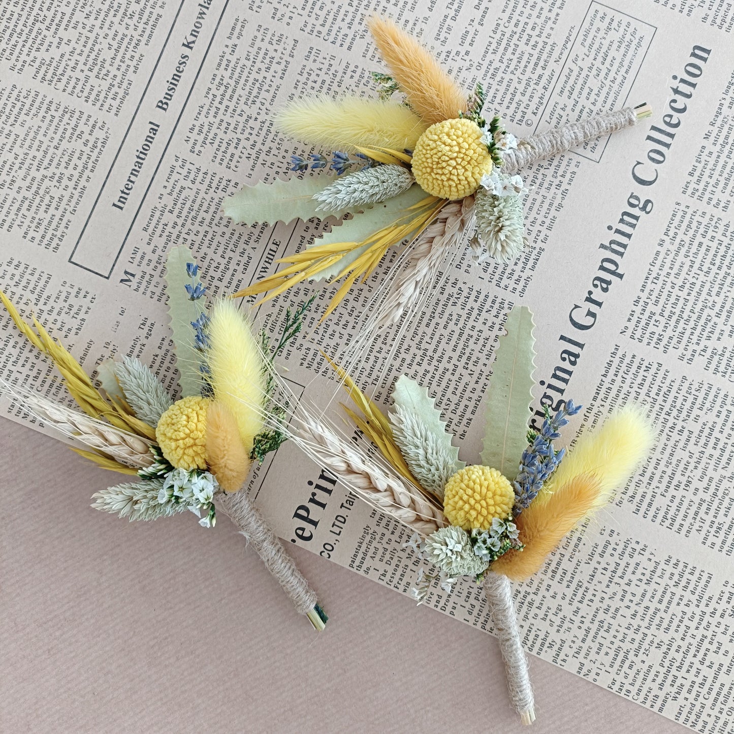 dried flower boutonnieres with yellow craspedia, bunny tails, and preserved foliage â€“ ideal for rustic or boho weddings and groomsmen