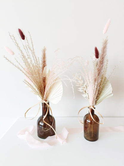wedding table decor, event table styling, elegant centerpiece, floral arrangement, table setting, rustic wedding, boho table decor, vintage table setup, romantic tablescape, minimalist wedding decor, luxury event design, dried flower centerpiece, soft color palette, aesthetic table arrangement, candlelit dinner, natural wedding decor, modern table styling, cozy reception setup, timeless elegance, pastel wedding theme, chic tablescape, organic table decor, sophisticated floral design, intimate wedding setup