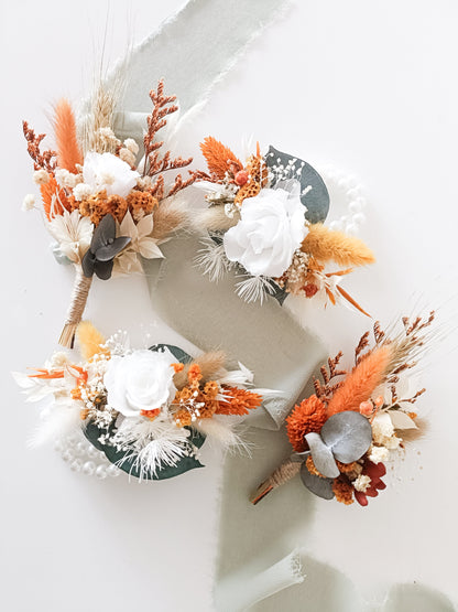 Mini bouquet or boutonniere and wrist corsage made with preserved bunny tails, strawflowers, eucalyptus and orange accents — perfect match to bridal bouquet