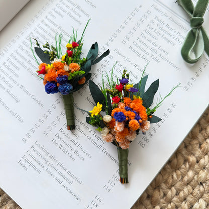 mini boutonniÃ¨re with preserved protea and dried flower accents â€“ rustic wedding accessory.