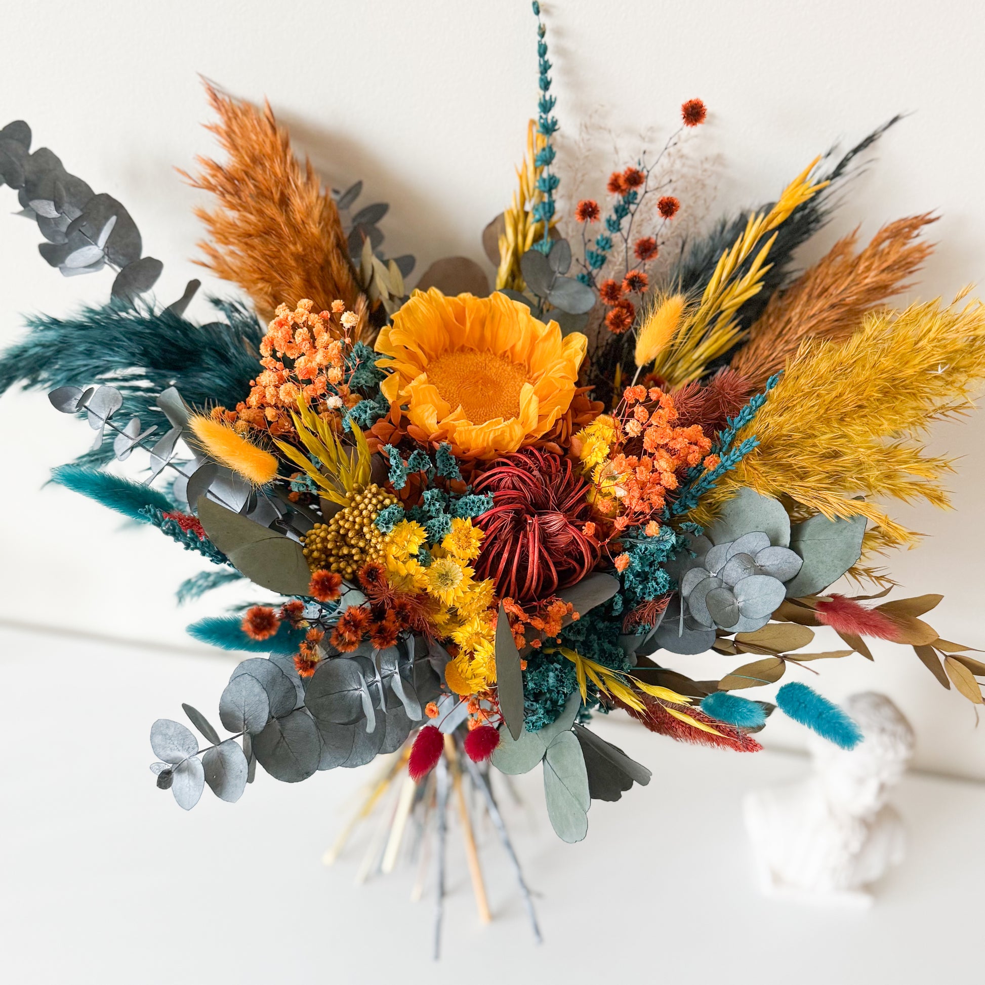 Preserved sunflower detail in a handmade boho dried flower bouquet