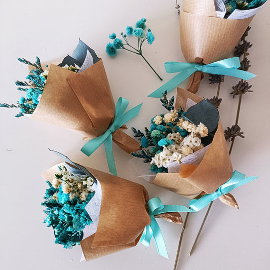 Set of mini teal dried flower favours with eucalyptus and preserved blooms, ideal for events and thank-you gifting.
 