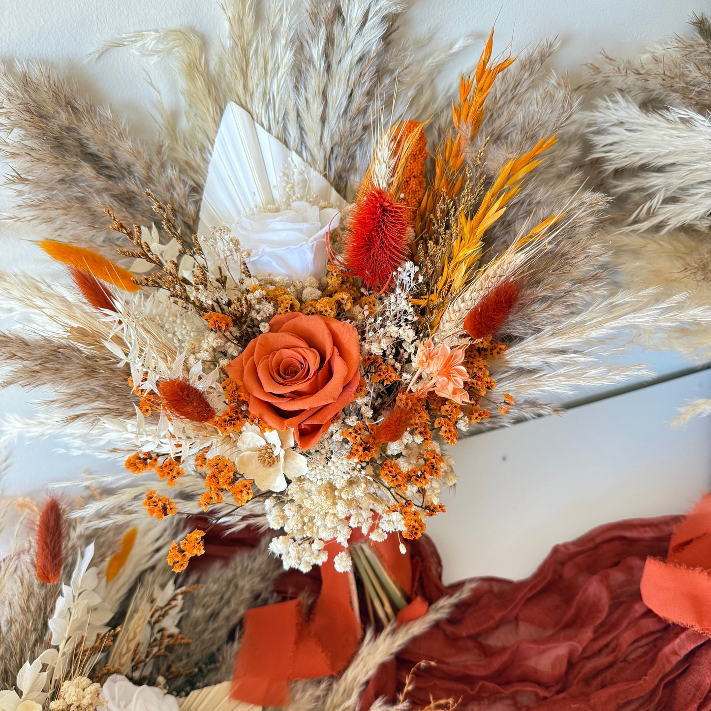 Terracotta pampas floral arrangement with preserved roses