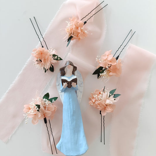 Romantic boho wedding hairpins made with preserved flowers and greenery in soft pastel tones