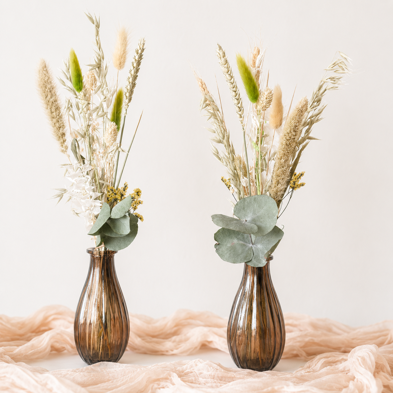 Neutral dried flower arrangement with preserved eucalyptus, wheat and bunny tails, vase not included.