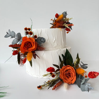 Decorative cake topper with autumnal flowers for wedding cake