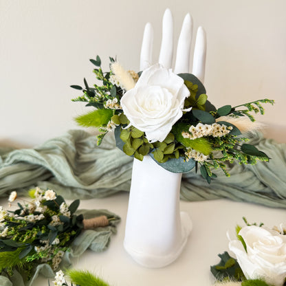 Handmade greenery wrist corsage with preserved leaves and florals, rustic wedding style