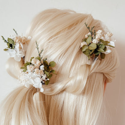 Bridal hairstyle with white dried flower hair pins and preserved greenery, styled for Australian boho and rustic weddings