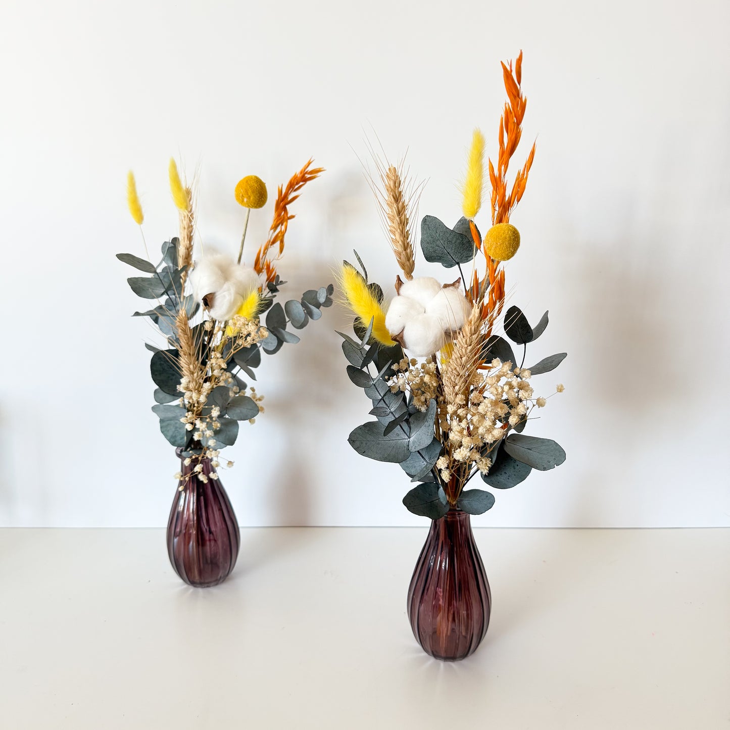 Yellow and white boho dried flower vase styling with cotton and eucalyptus, perfect for home or wedding table decor